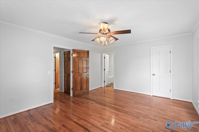 unfurnished room with ornamental molding, hardwood / wood-style flooring, and ceiling fan