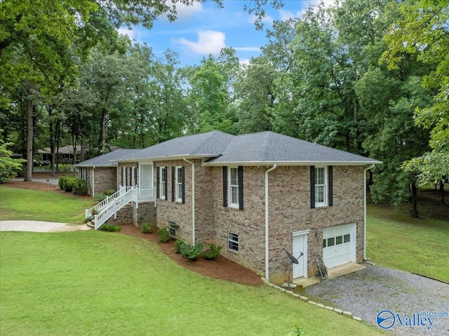 view of front of property featuring a garage and a front lawn