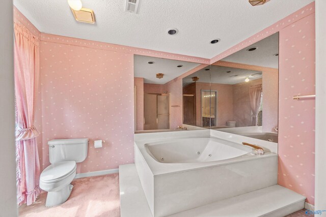 bathroom with tile patterned floors, vanity, a textured ceiling, toilet, and a shower with curtain