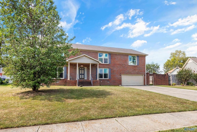 view of front of property featuring a front yard and a garage