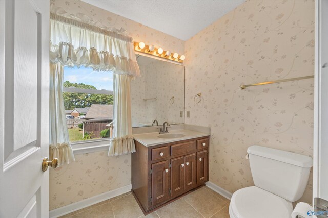 living room with a tray ceiling, ceiling fan, light colored carpet, and a textured ceiling