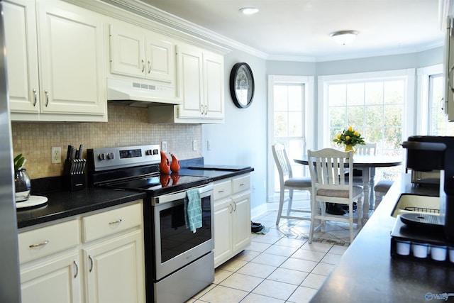 kitchen featuring stainless steel electric range oven, light tile patterned flooring, white cabinetry, and crown molding