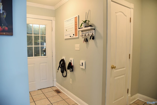 doorway to outside featuring light tile patterned floors and ornamental molding