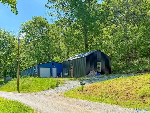 140 Ben Johnson Rd, Pulaski, TN 38478 - view of outdoor structure with driveway and a view of trees