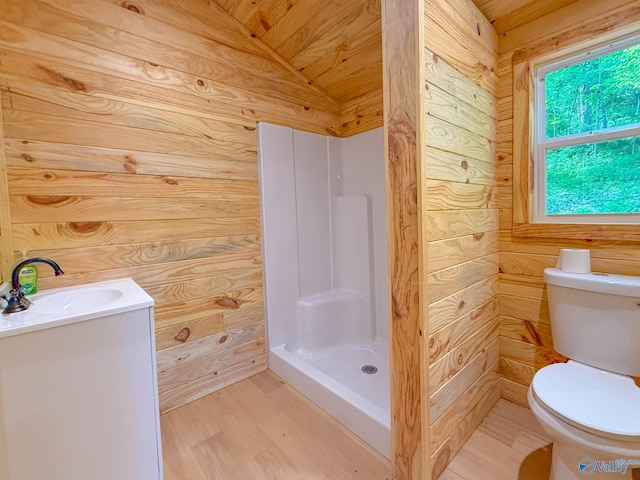 140 Ben Johnson Rd, Pulaski, TN 38478 - full bathroom with wood walls, toilet, a stall shower, vanity, and vaulted ceiling