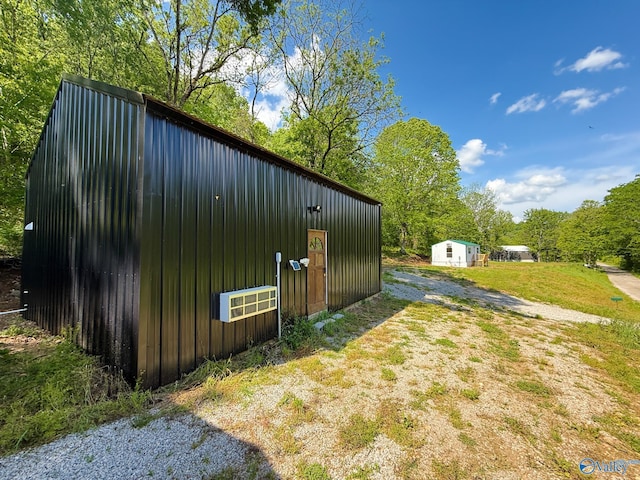 140 Ben Johnson Rd, Pulaski, TN 38478 - view of side of home featuring an outbuilding, board and batten siding, and a pole building