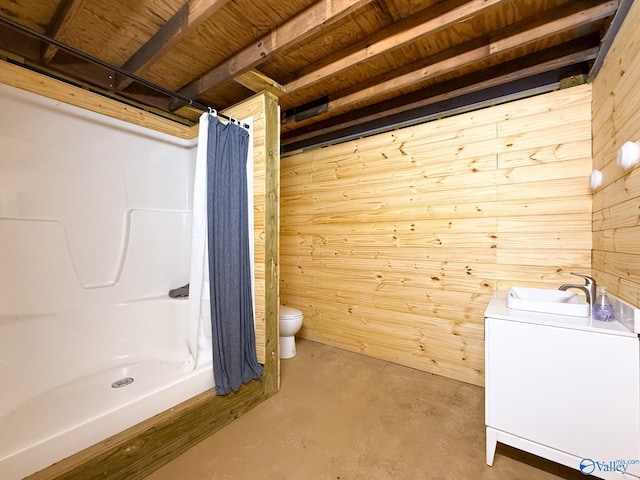 140 Ben Johnson Rd, Pulaski, TN 38478 - full bathroom with wood walls, concrete floors, toilet, vanity, and a shower with shower curtain