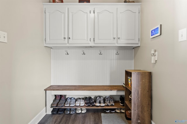 mudroom featuring baseboards and wood finished floors