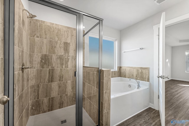 4226 Textile Ln SW, Huntsville, AL 35805 - full bathroom with a garden tub, a stall shower, wood finished floors, and plenty of natural light