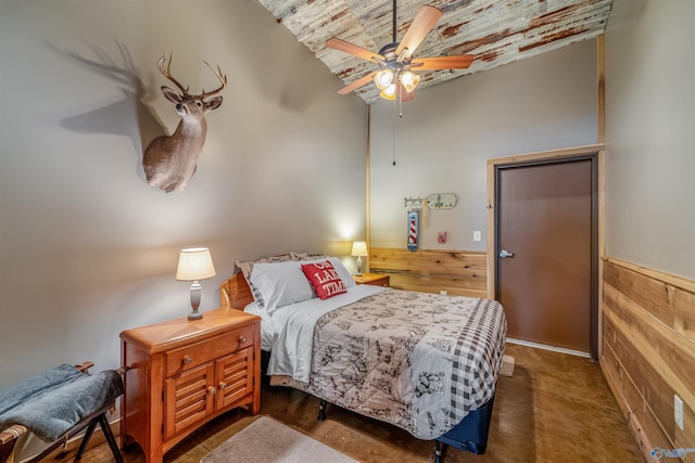 bedroom with brick ceiling and wainscoting