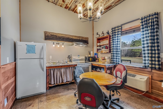 interior space with a wall unit AC, brick ceiling, a chandelier, and concrete flooring