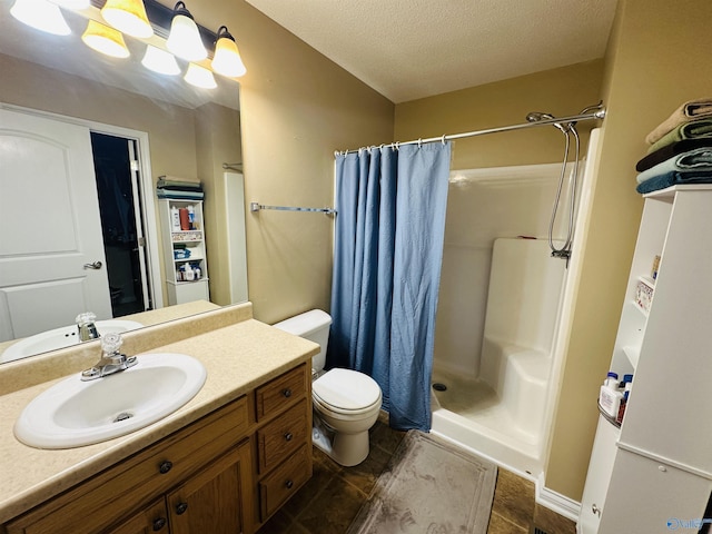 bathroom featuring vanity, a shower with curtain, a textured ceiling, and toilet