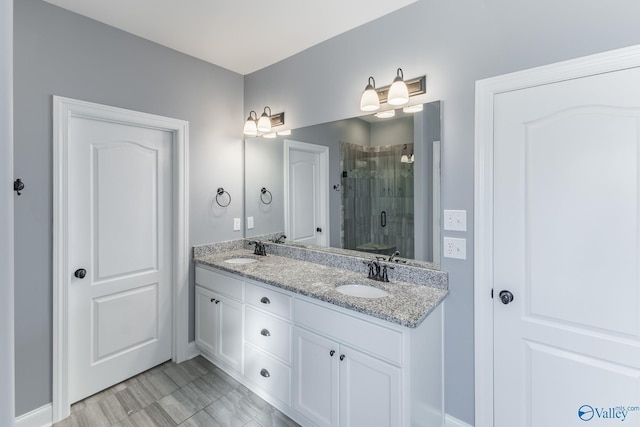 bathroom with vanity and an enclosed shower