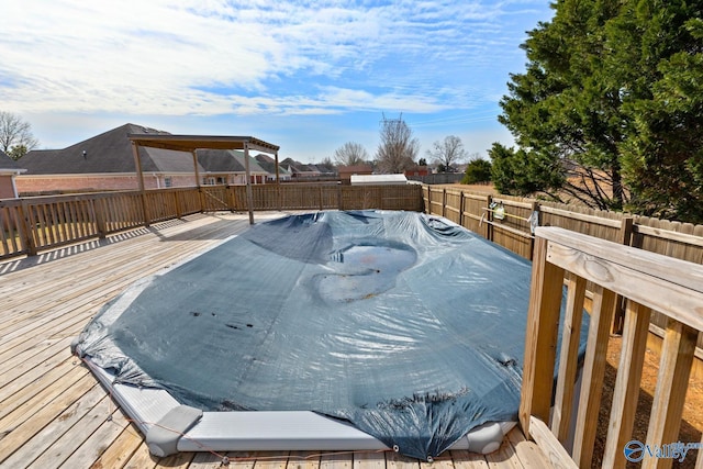 deck with a fenced backyard