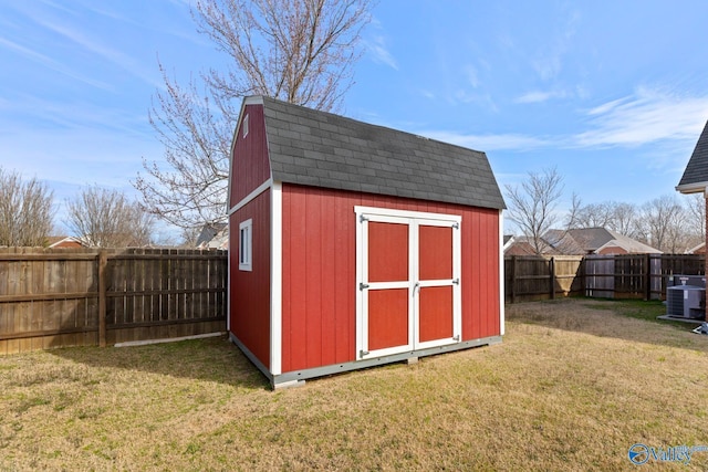 view of shed featuring central AC unit and a fenced backyard