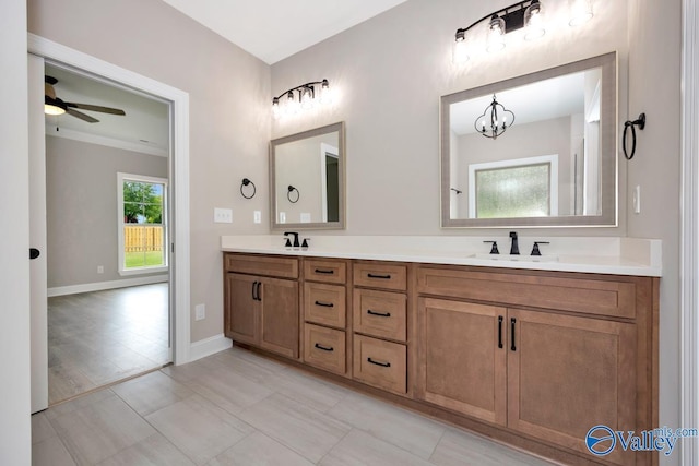 210 Lyndon Cove Rd, Huntsville, AL 35811 - bathroom featuring double vanity, a ceiling fan, and a chandelier