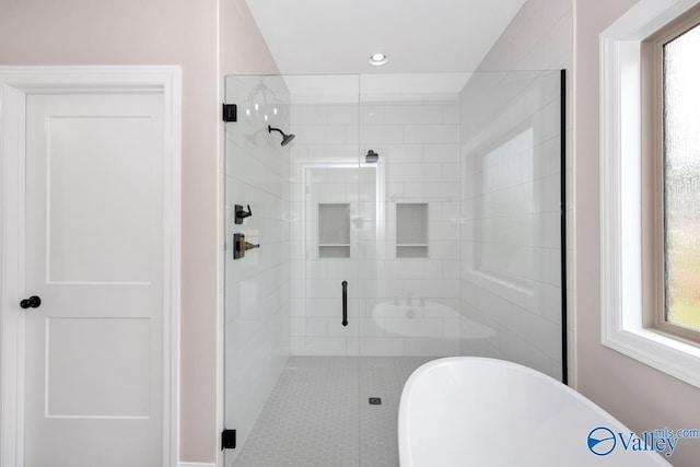 210 Lyndon Cove Rd, Huntsville, AL 35811 - bathroom with a soaking tub, a stall shower, healthy amount of natural light, and recessed lighting