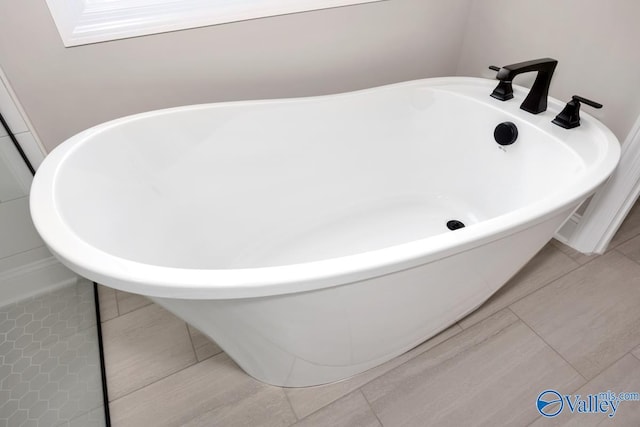 210 Lyndon Cove Rd, Huntsville, AL 35811 - bathroom with a soaking tub and tile patterned flooring