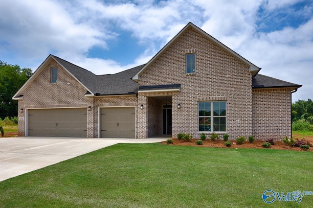 210 Lyndon Cove Rd, Huntsville, AL 35811 - view of front facade featuring brick siding, a front yard, a garage, driveway, and roof with shingles