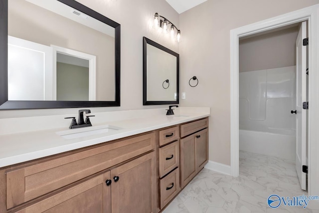 210 Lyndon Cove Rd, Huntsville, AL 35811 - bathroom with marble look tile flooring, double vanity, and tub / shower combination