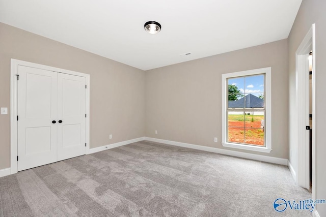 210 Lyndon Cove Rd, Huntsville, AL 35811 - unfurnished bedroom with carpet flooring and a closet