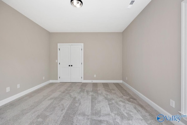 210 Lyndon Cove Rd, Huntsville, AL 35811 - spare room with light carpet and baseboards