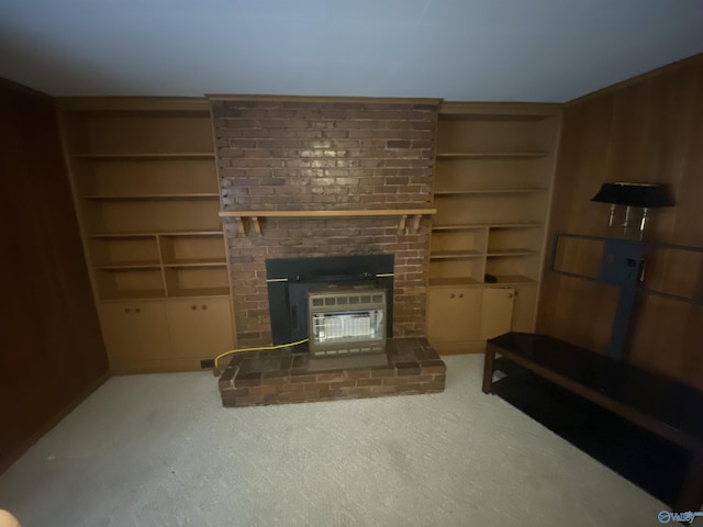 carpeted living room with built in features, a brick fireplace, and wood walls