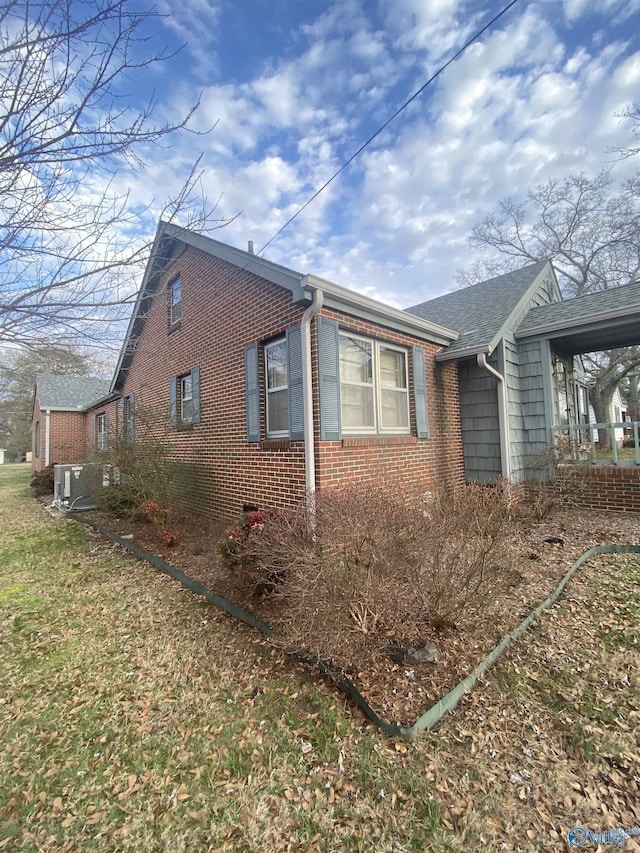 view of side of home featuring central air condition unit