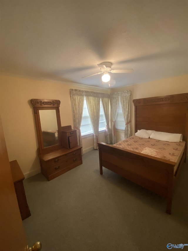 bedroom featuring dark carpet and ceiling fan