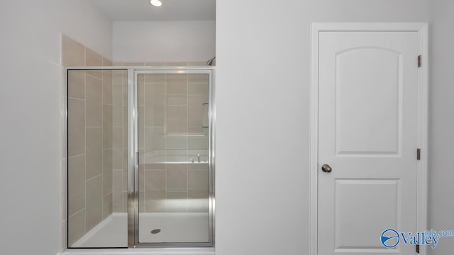 full bath featuring a shower stall