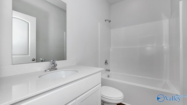 bathroom with vanity, shower / tub combination, and toilet