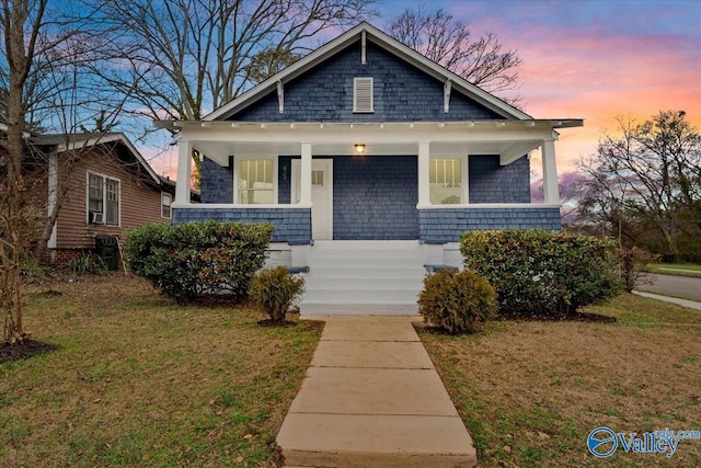 bungalow with a lawn and a porch