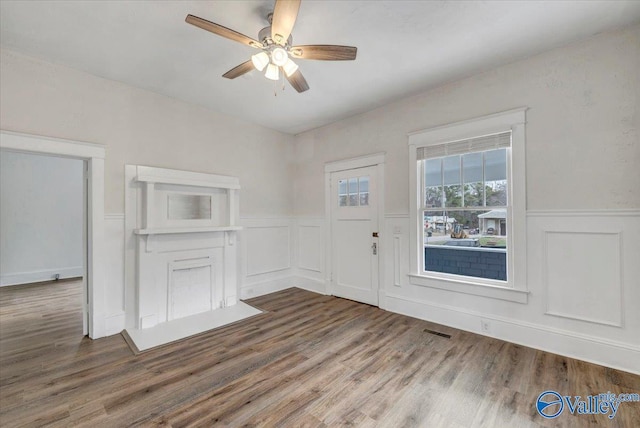 spare room with hardwood / wood-style flooring and ceiling fan