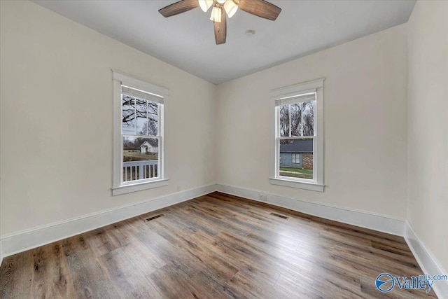 unfurnished room featuring hardwood / wood-style flooring and ceiling fan