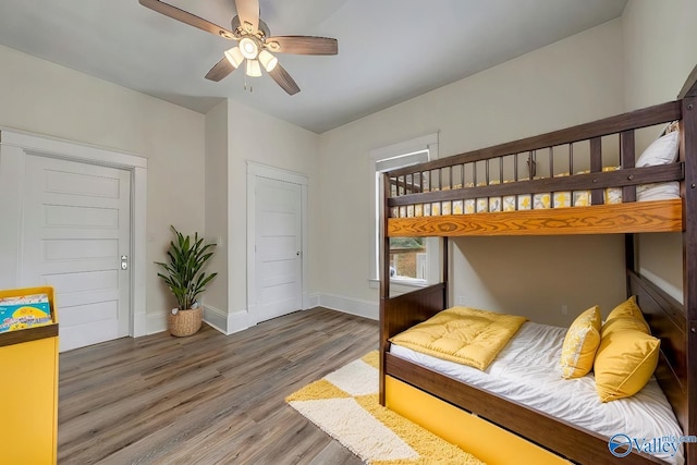 bedroom with ceiling fan and hardwood / wood-style floors