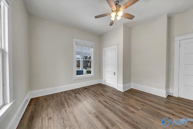 spare room featuring ceiling fan and hardwood / wood-style floors