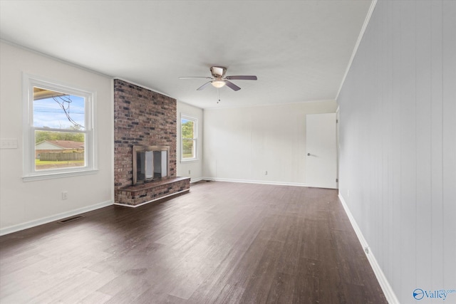 605 Holland Dr SW, Decatur, AL 35601 - unfurnished living room with wood finished floors, a ceiling fan, a brick fireplace, and baseboards