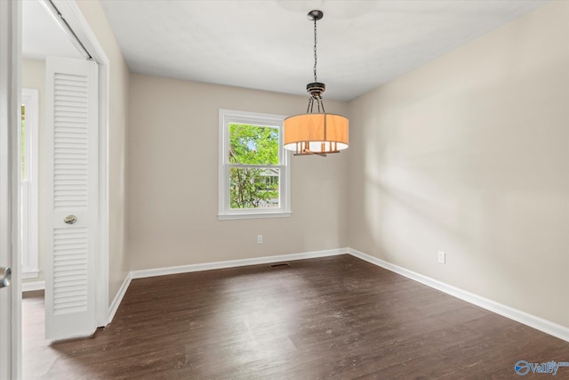 605 Holland Dr SW, Decatur, AL 35601 - empty room featuring baseboards and wood finished floors