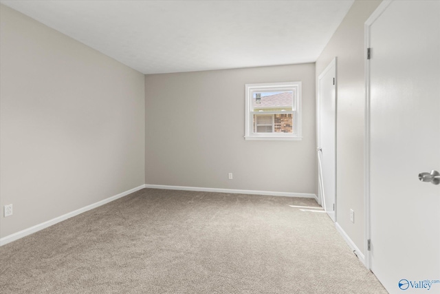 605 Holland Dr SW, Decatur, AL 35601 - unfurnished bedroom with carpet and baseboards