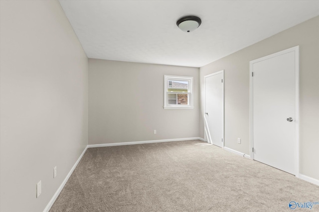 605 Holland Dr SW, Decatur, AL 35601 - unfurnished bedroom featuring carpet floors and baseboards