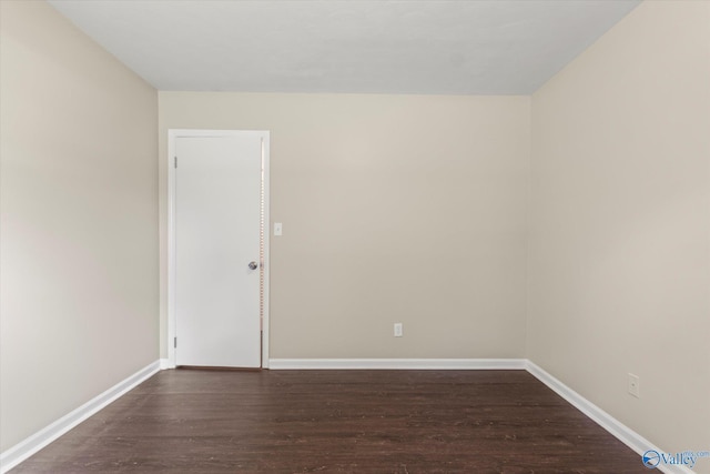 605 Holland Dr SW, Decatur, AL 35601 - empty room with dark wood finished floors and baseboards
