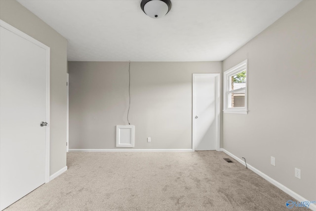 605 Holland Dr SW, Decatur, AL 35601 - unfurnished bedroom with carpet floors and baseboards
