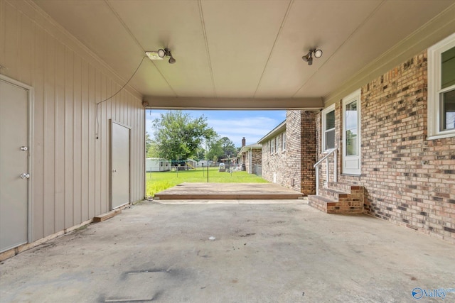 605 Holland Dr SW, Decatur, AL 35601 - view of patio featuring a carport and entry steps