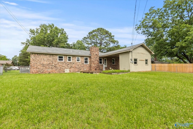 605 Holland Dr SW, Decatur, AL 35601 - rear view of property featuring a chimney