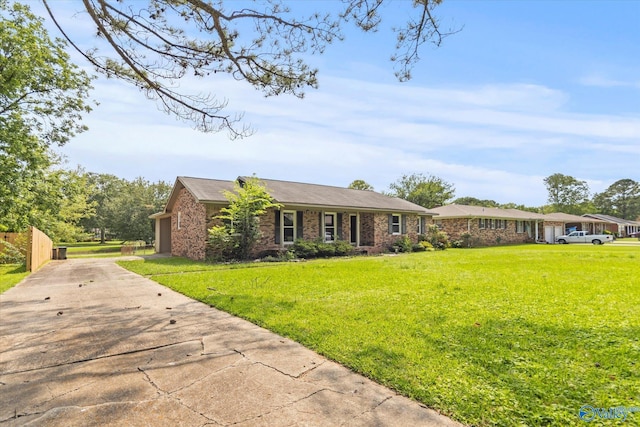 605 Holland Dr SW, Decatur, AL 35601 - ranch-style house featuring driveway and a front lawn