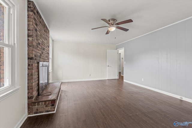 605 Holland Dr SW, Decatur, AL 35601 - unfurnished living room with wood finished floors, a ceiling fan, a brick fireplace, baseboards, and ornamental molding