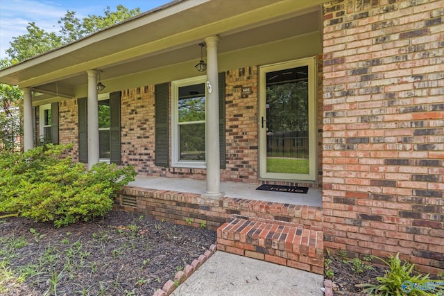 605 Holland Dr SW, Decatur, AL 35601 - view of exterior entry with brick siding and covered porch