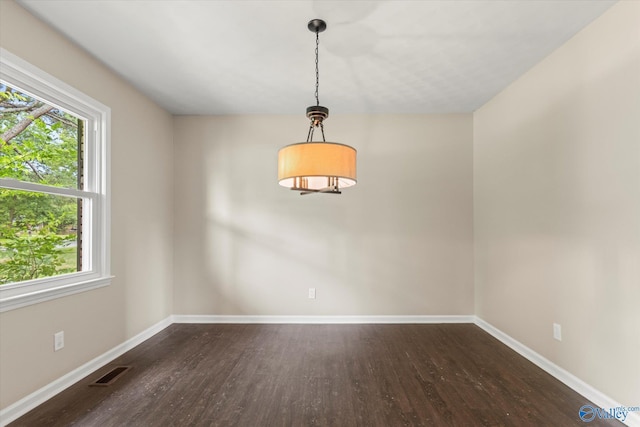 605 Holland Dr SW, Decatur, AL 35601 - unfurnished room featuring wood finished floors, plenty of natural light, and baseboards