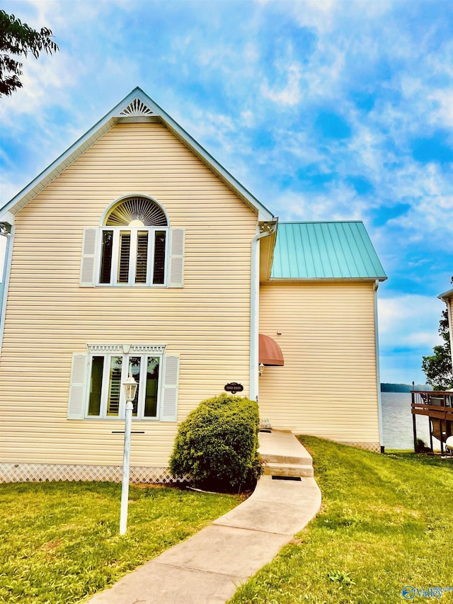 6468 Turtle Bay Way E, Athens, AL 35611 - view of side of property with a yard, a standing seam roof, and metal roof