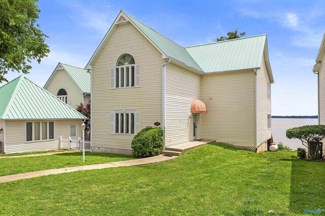 6468 Turtle Bay Way E, Athens, AL 35611 - back of house with metal roof and a lawn